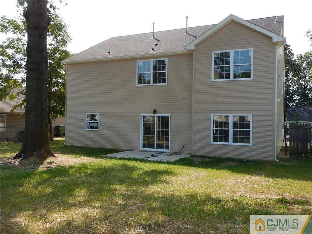 62 Idlewild Road Edison, NJ 08817 - Photo 11 of 11 a front view of a house with a yard