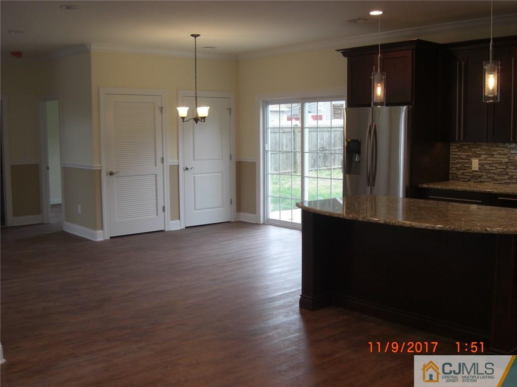 62 Idlewild Road Edison, NJ 08817 - Photo 6 of 11 a view of a room with wooden floor and windows