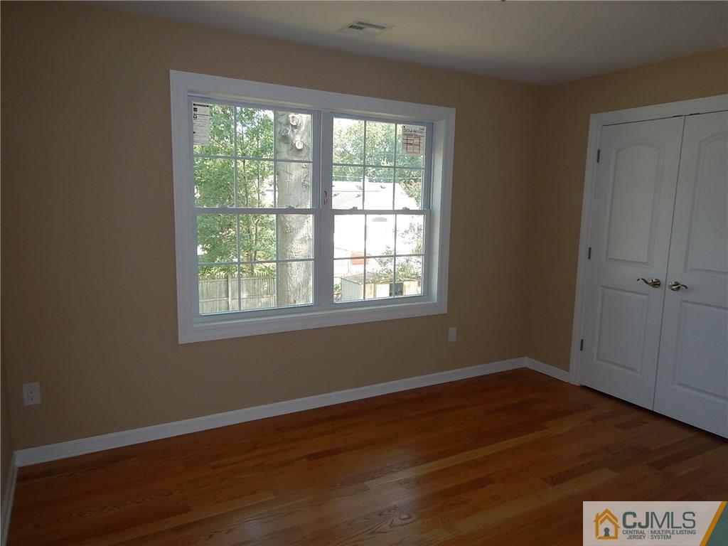 62 Idlewild Road Edison, NJ 08817 - Photo 10 of 11 a view of a room with wooden floor and windows