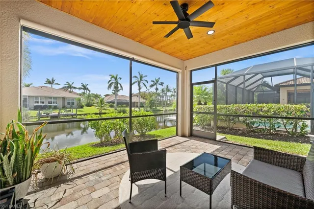 a balcony with table and chairs