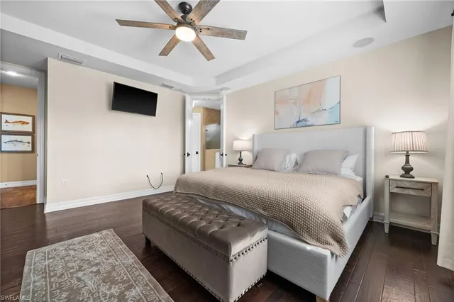 a spacious bedroom with a bed and a couch