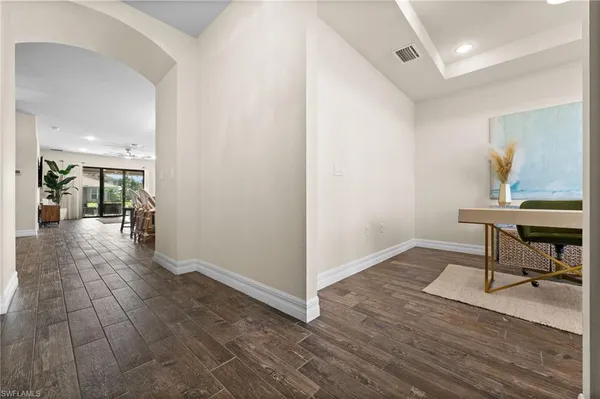 a view of a livingroom with furniture and workspace