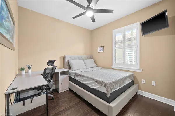 a bed room with a bed and a chandelier