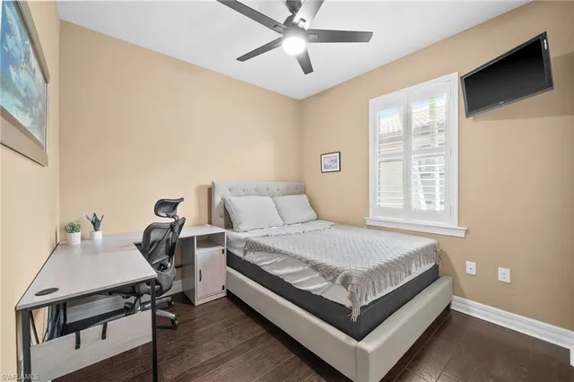 a bed room with a bed and a chandelier