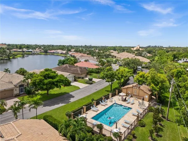 an aerial view of a house with a lake view