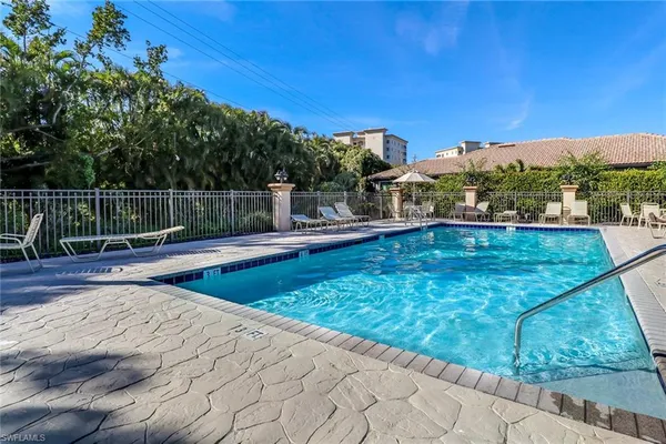 a view of a swimming pool with a patio