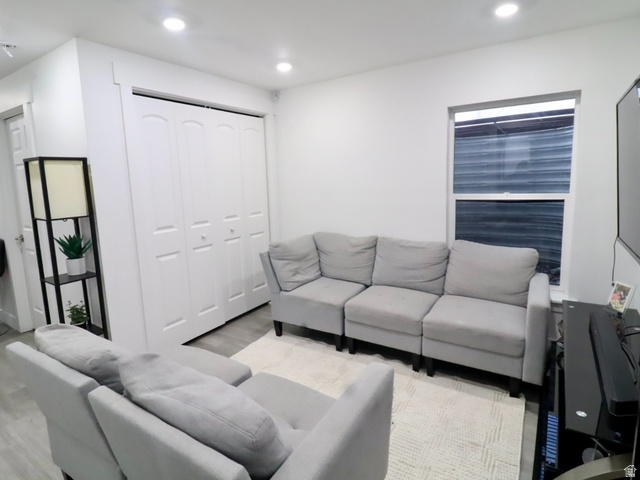 8240 Cascade Vw Way Magna, UT 84044 - Photo 15 of 18 Living room featuring recessed lighting and light wood-type flooring