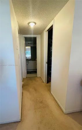 a view of an empty room and fire place