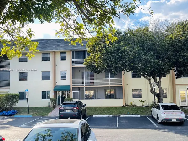a view of a swimming pool with a yard