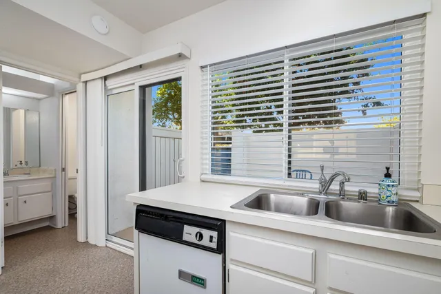 a kitchen with a sink and cabinets