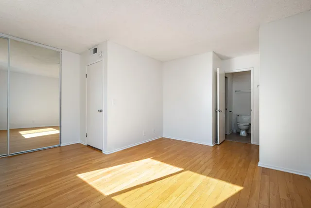 a bathroom with a granite countertop sink mirror and double