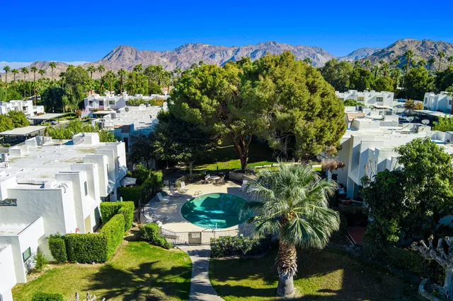 a view of yard with swimming pool and outdoor seating
