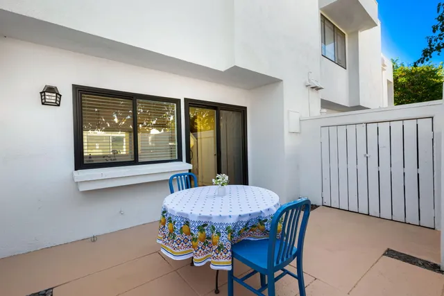 a view of a dining room with furniture and a window