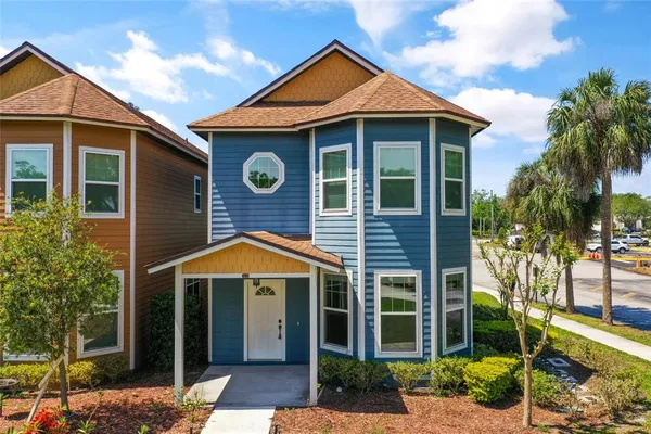 a front view of a house with garden