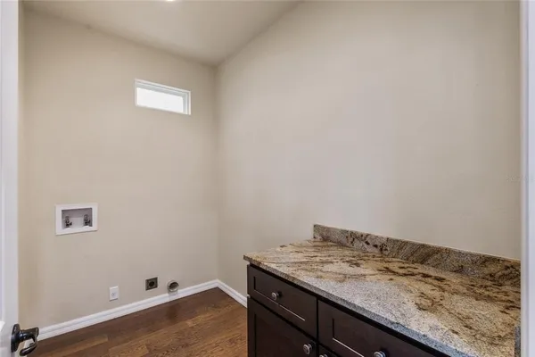 a bathroom with a granite countertop sink and vanity