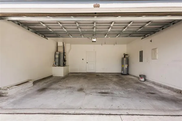 an aerial view of multiple houses with a yard