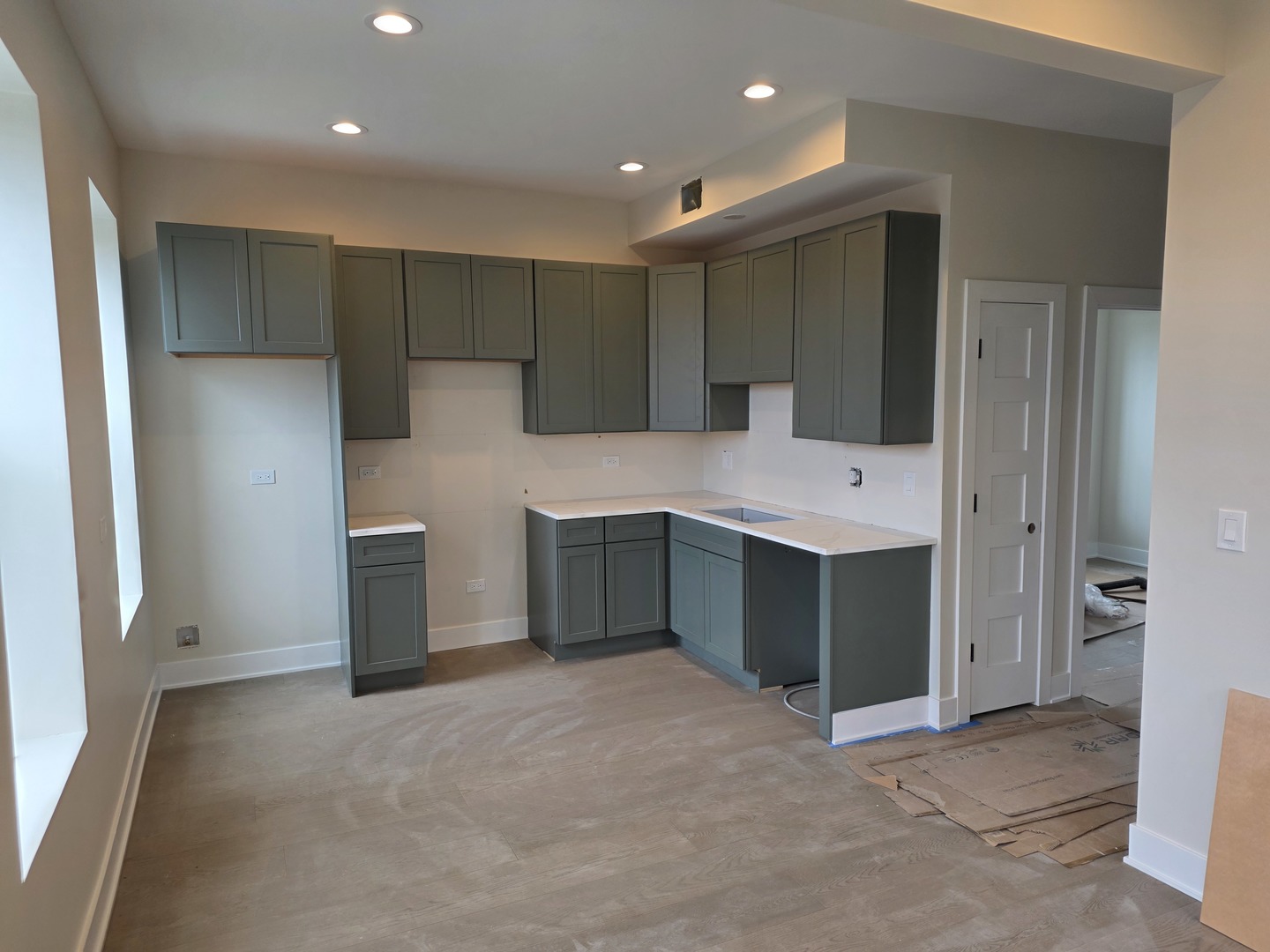 3216 South Morgan Street, Unit 2F Chicago, IL 60608 - Photo 5 of 9 a kitchen with a refrigerator and a sink