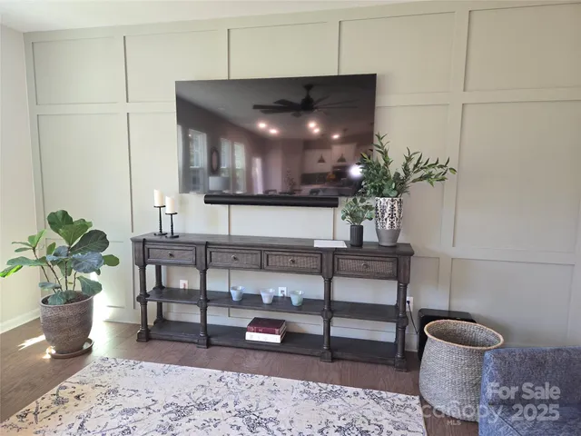 a view of room with furniture and wooden floor