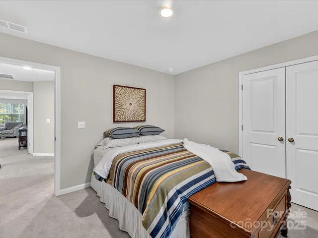 a bedroom with a bed and bathroom