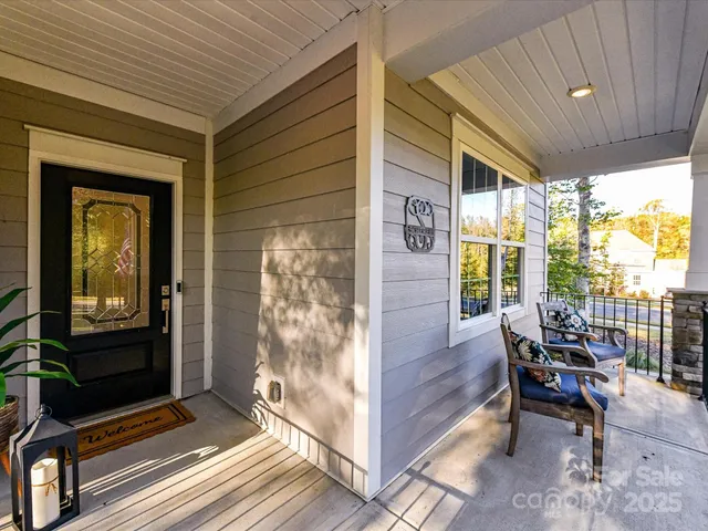 a outdoor living space with patio furniture and a potted plant