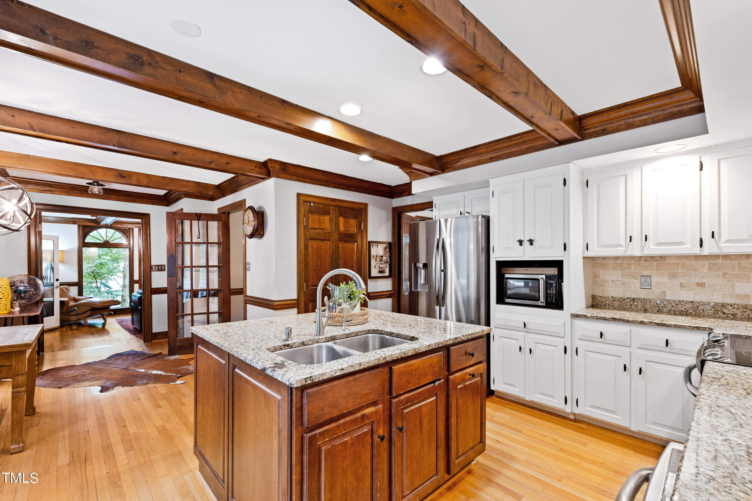 3405 Stallion Court Raleigh, NC 27613 - Photo 17 of 55 a kitchen with stainless steel appliances granite countertop a stove and a refrigerator