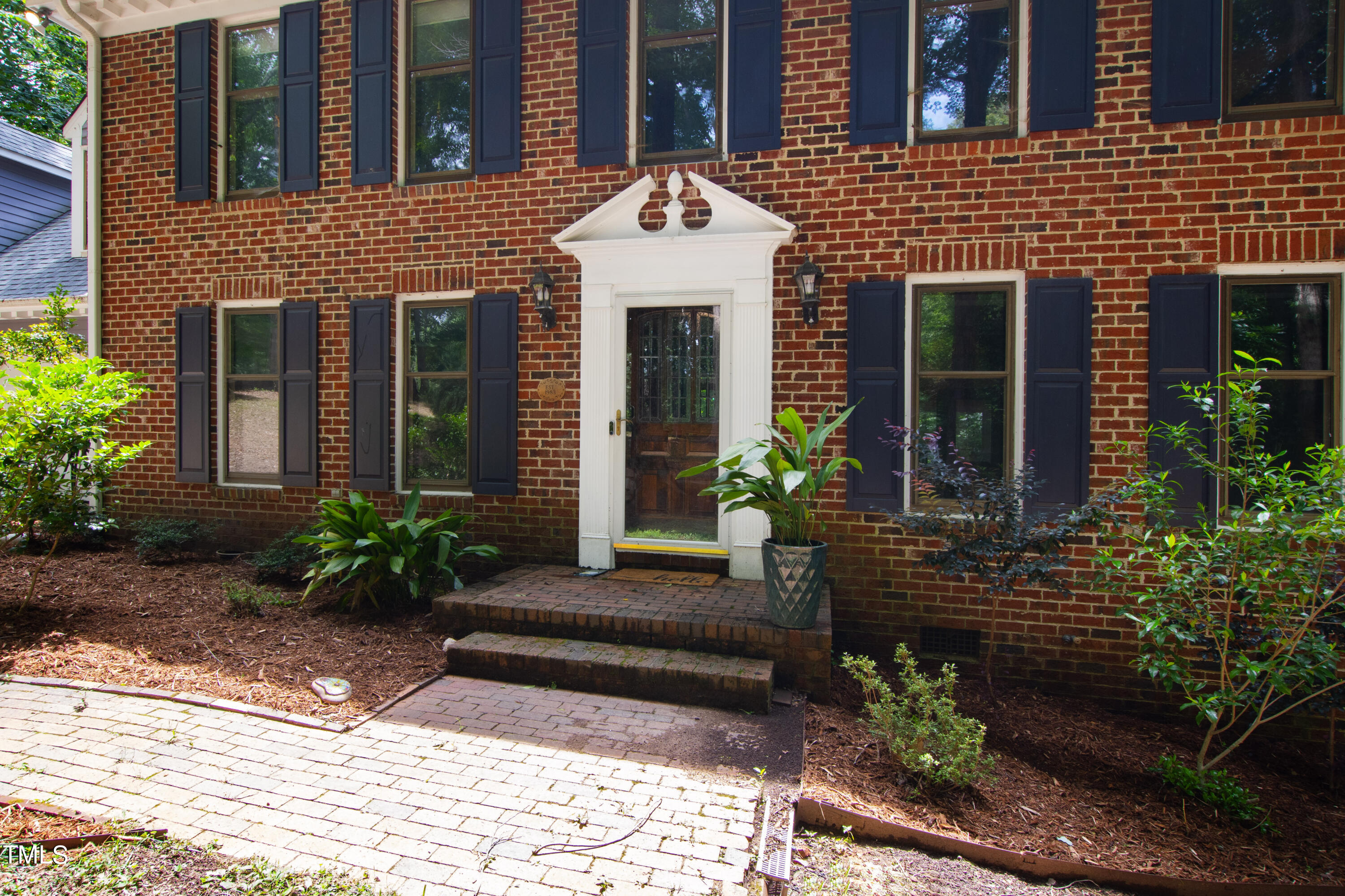 3405 Stallion Court Raleigh, NC 27613 - Photo 2 of 55 a front view of a house with plants