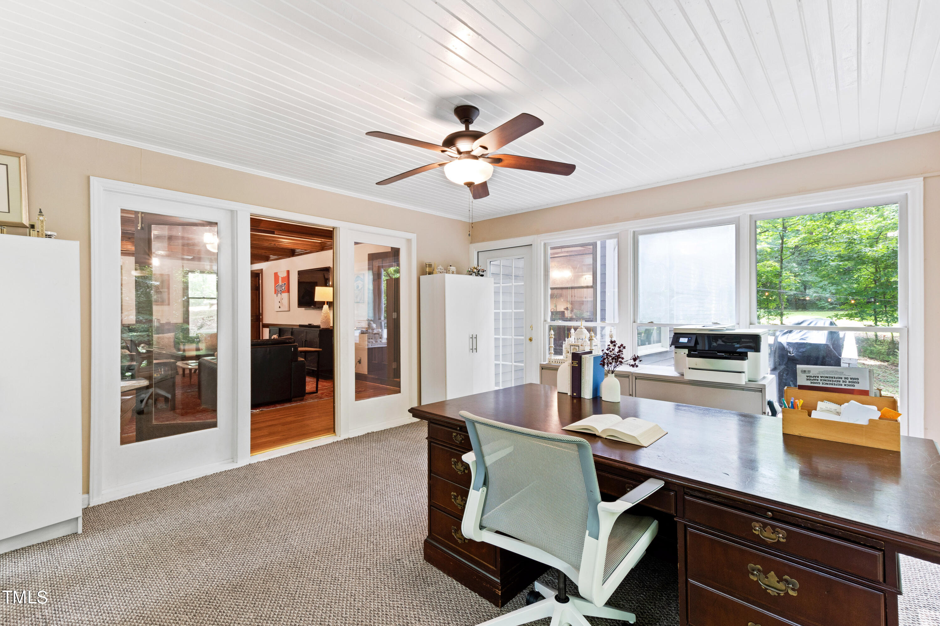 3405 Stallion Court Raleigh, NC 27613 - Photo 22 of 55 a room with stainless steel appliances a dining table and chairs with the floor to ceiling window
