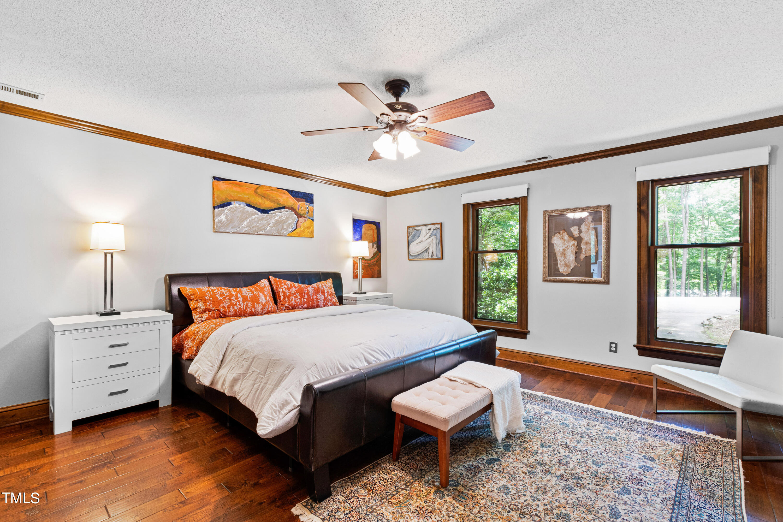 3405 Stallion Court Raleigh, NC 27613 - Photo 25 of 55 a bedroom with a bed and a chandelier