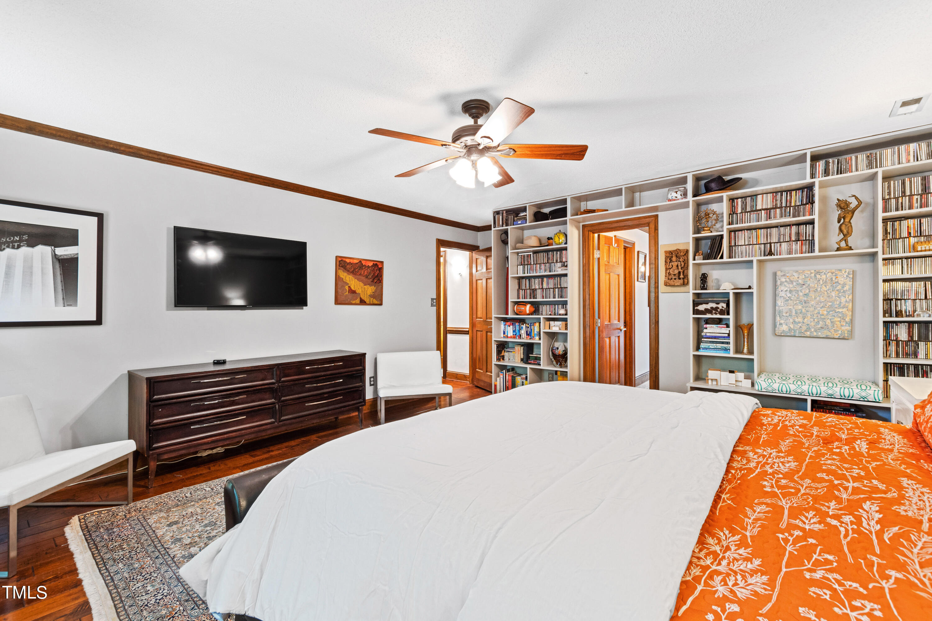 3405 Stallion Court Raleigh, NC 27613 - Photo 26 of 55 a bedroom with a bed and a flat screen tv