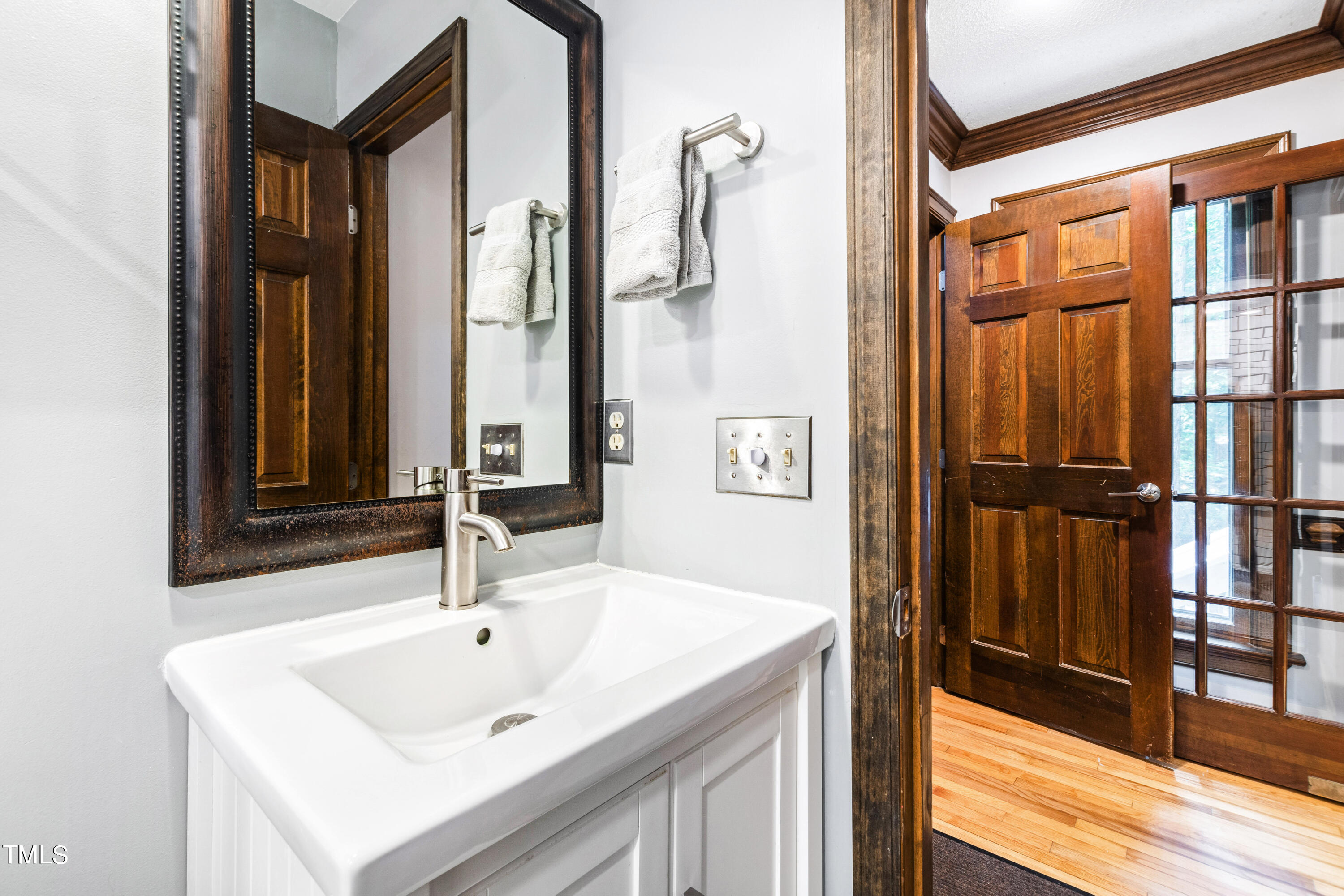 3405 Stallion Court Raleigh, NC 27613 - Photo 35 of 55 a bathroom with a sink and a mirror