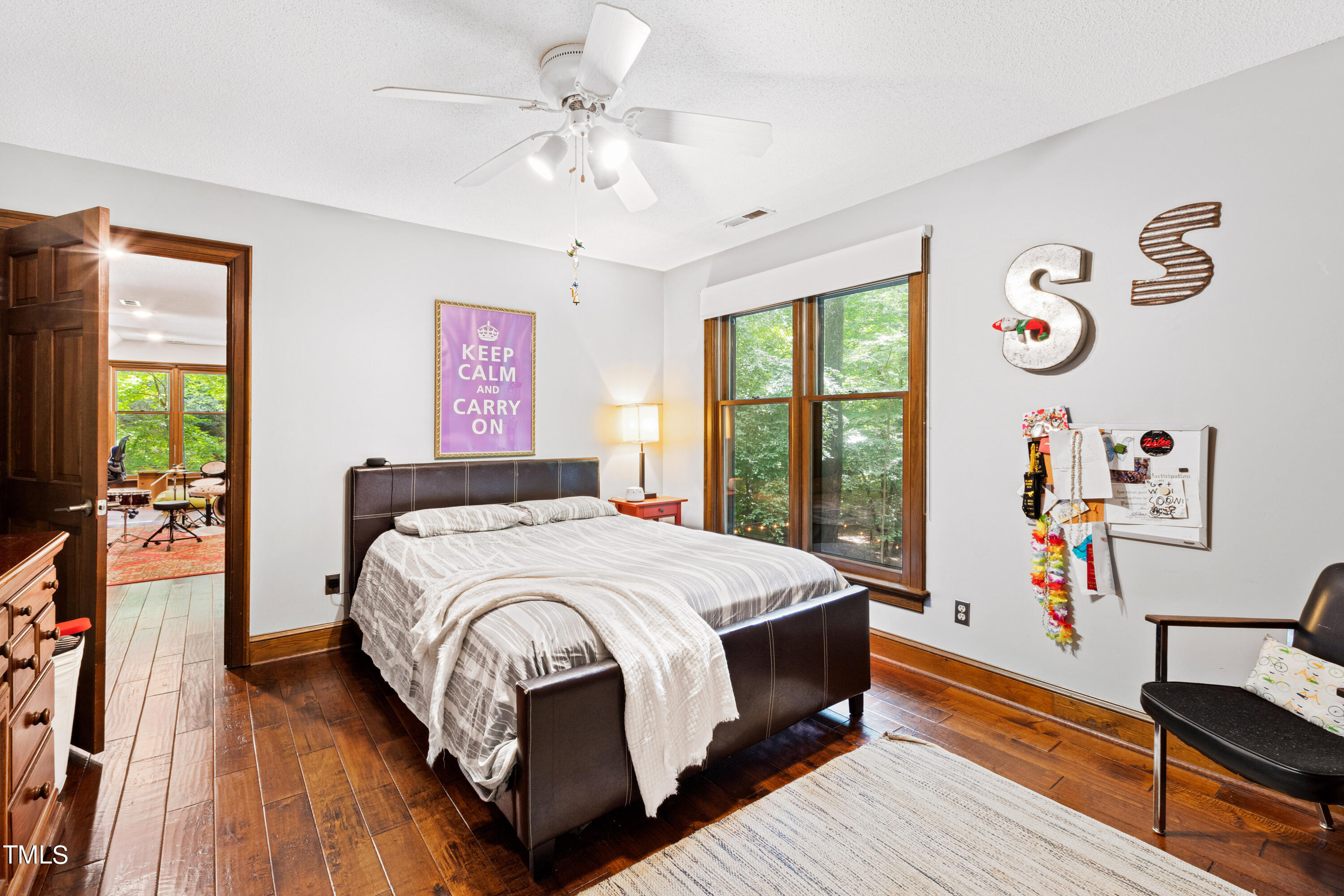 3405 Stallion Court Raleigh, NC 27613 - Photo 38 of 55 a bedroom with a large bed and a window