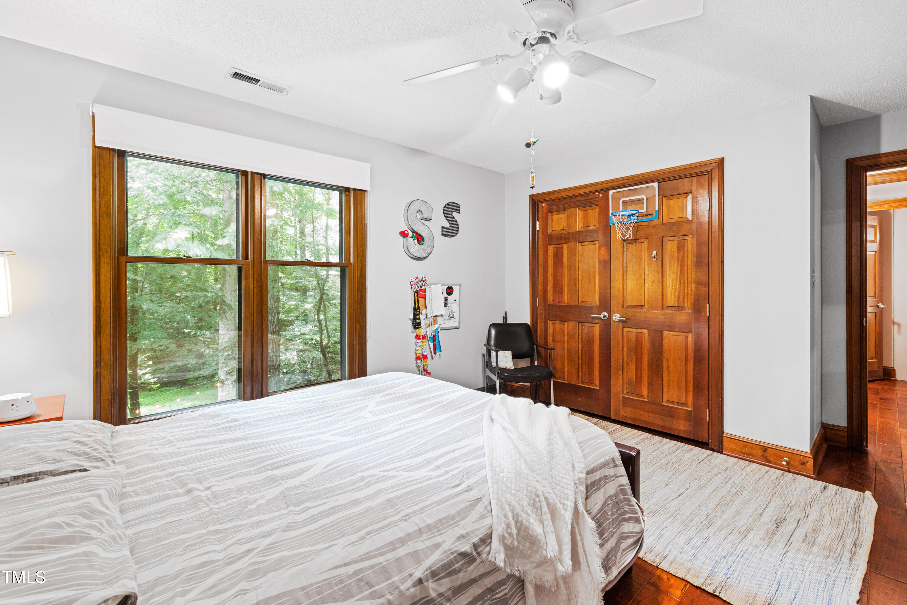 3405 Stallion Court Raleigh, NC 27613 - Photo 39 of 55 a bed sitting in a bedroom next to a window