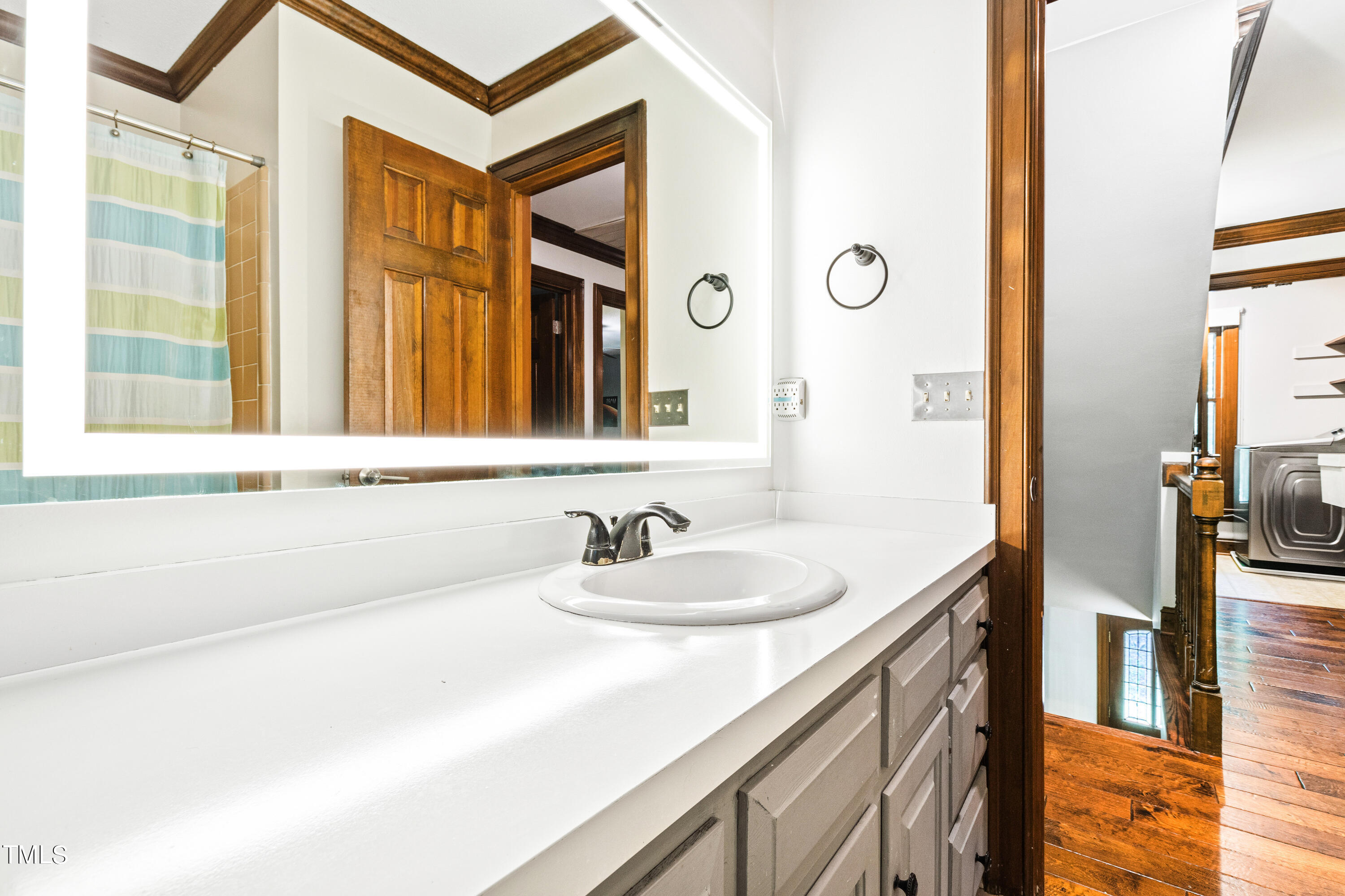 3405 Stallion Court Raleigh, NC 27613 - Photo 40 of 55 a bathroom with a sink and a mirror
