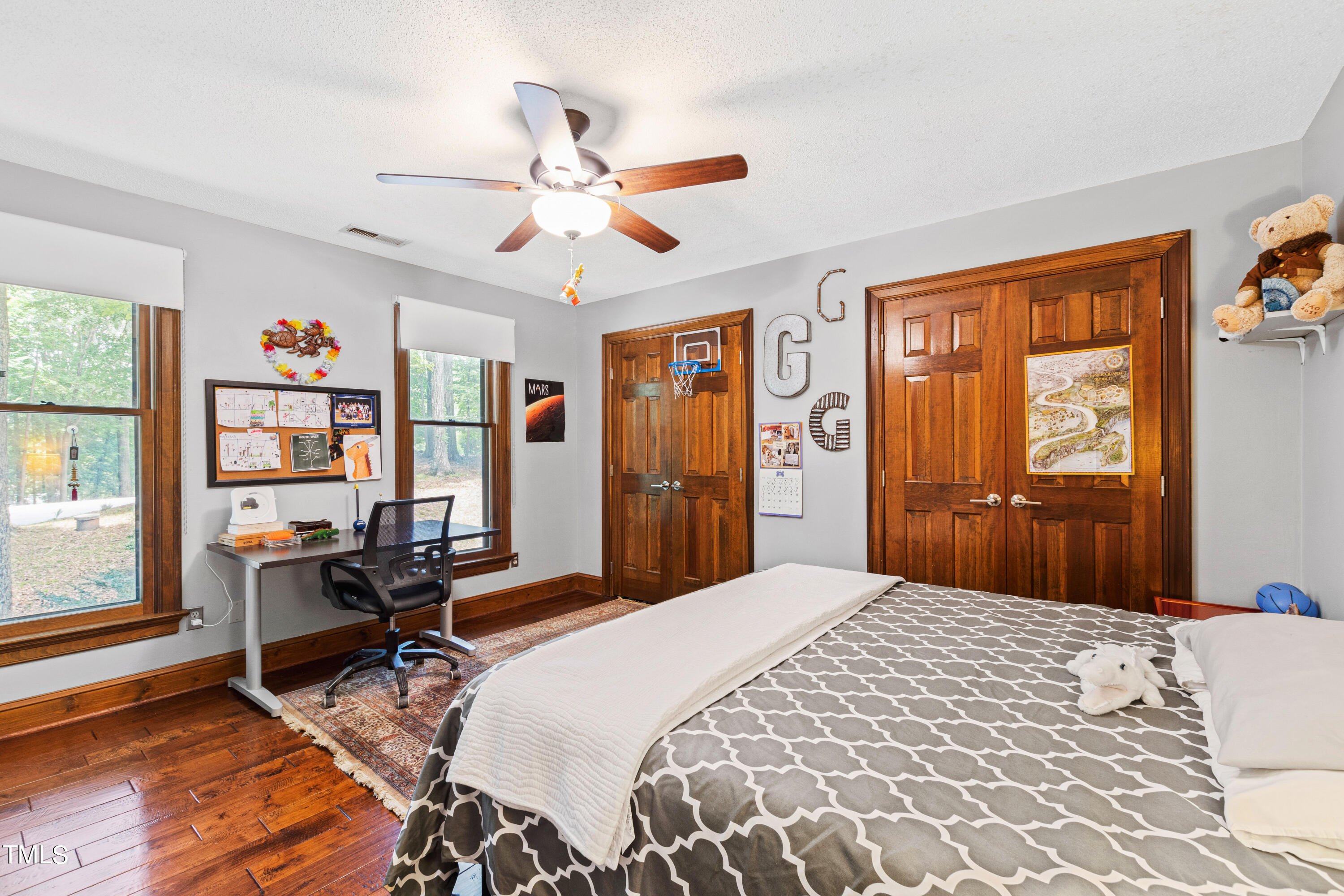 3405 Stallion Court Raleigh, NC 27613 - Photo 42 of 55 a bedroom with a bed and wooden floor