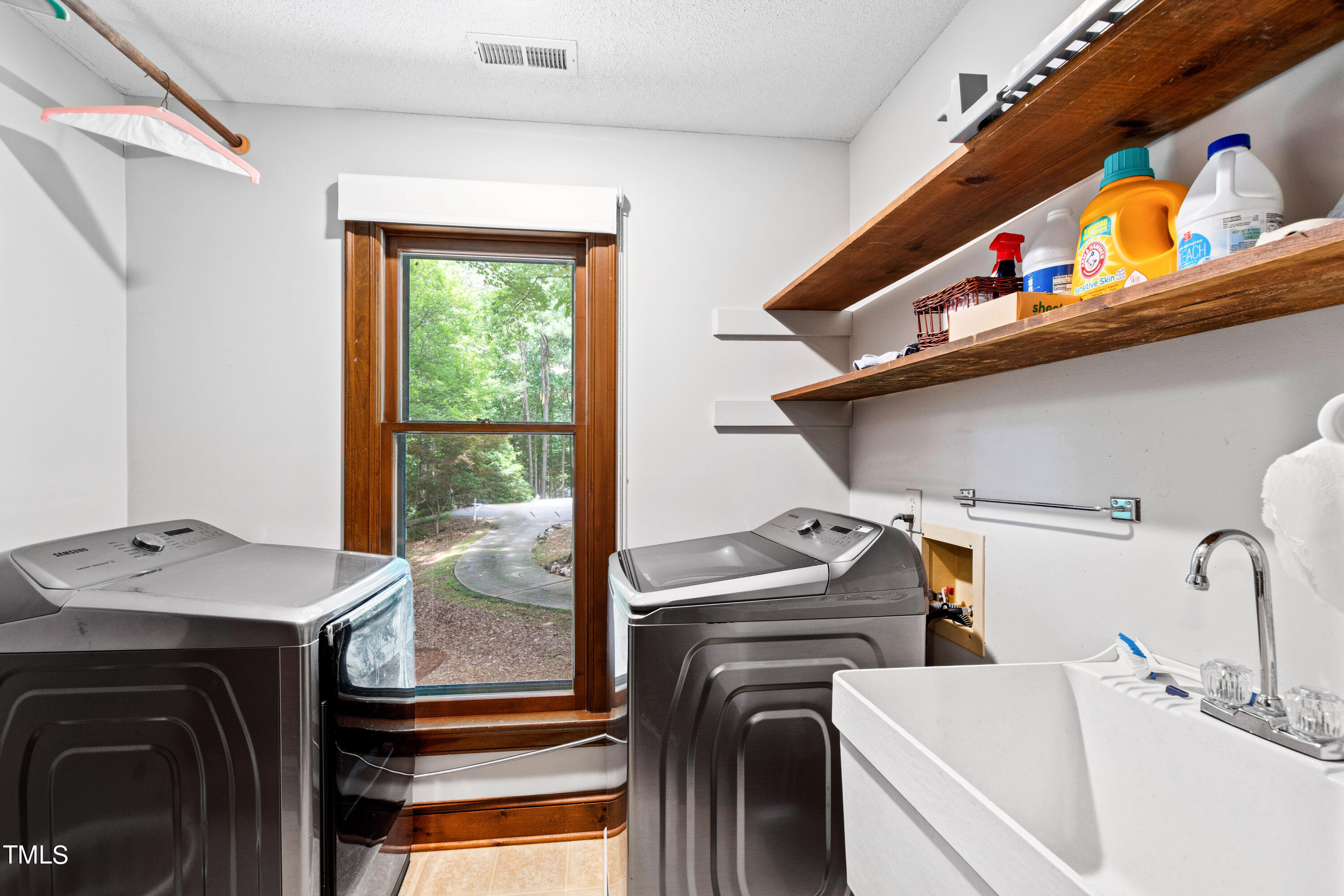 3405 Stallion Court Raleigh, NC 27613 - Photo 44 of 55 a utility room with dryer and washer