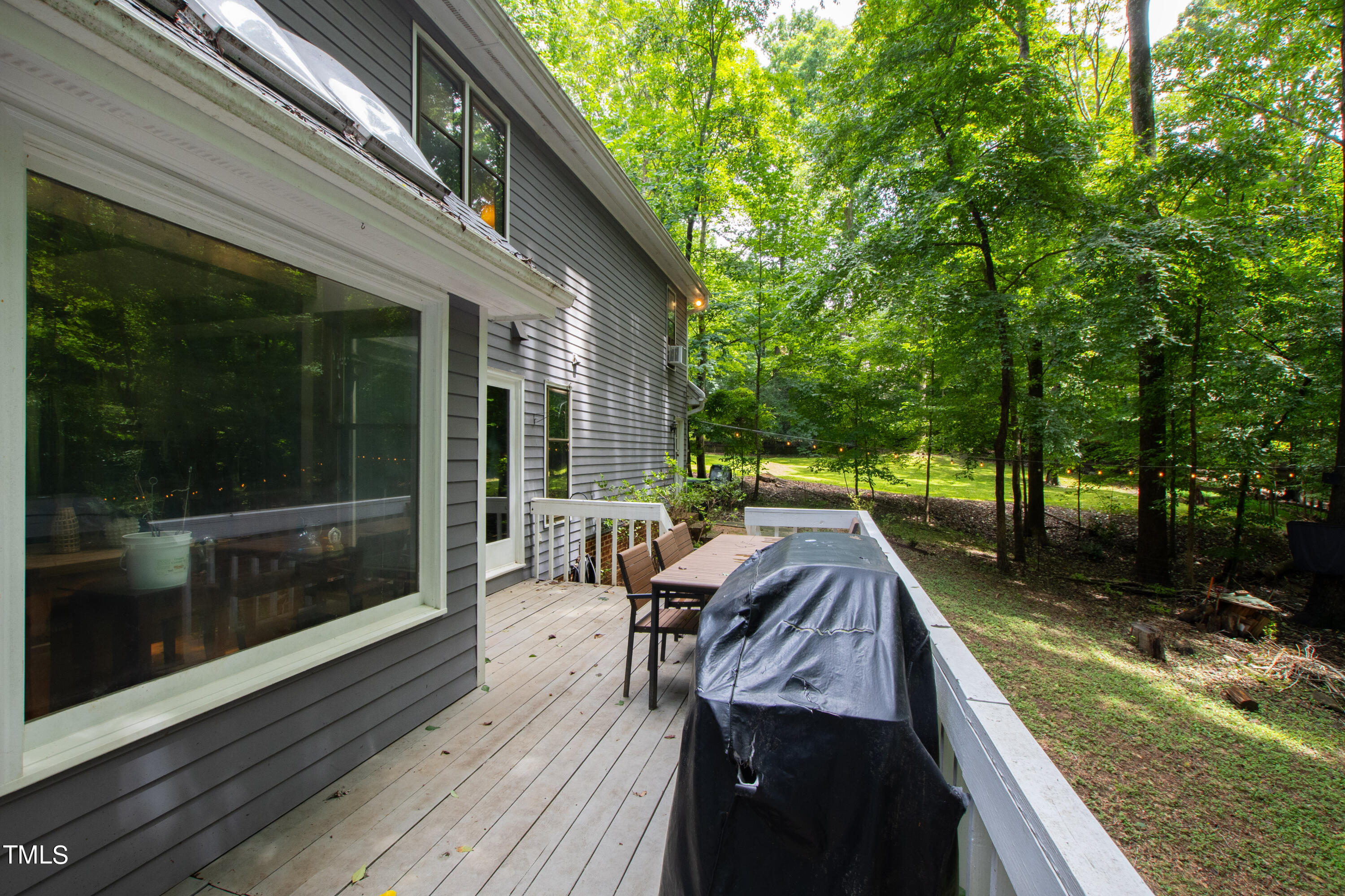 3405 Stallion Court Raleigh, NC 27613 - Photo 46 of 55 a view of house with backyard and outdoor seating