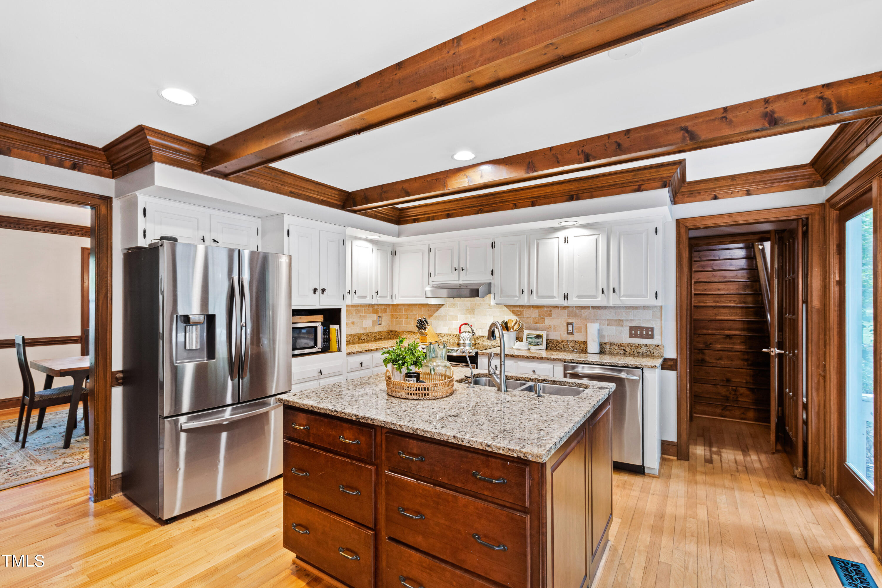 3405 Stallion Court Raleigh, NC 27613 - Photo 5 of 55 a kitchen with a refrigerator a stove and a wooden floor