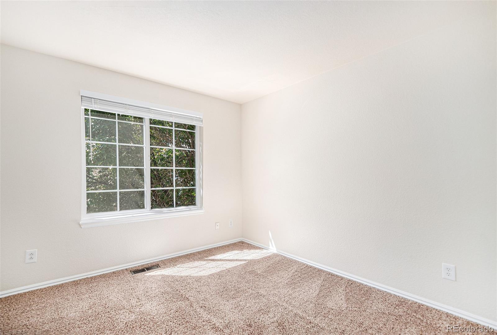 5253 Wangaratta Way Highlands Ranch, CO 80130 - Photo 21 of 43 an empty room with a window