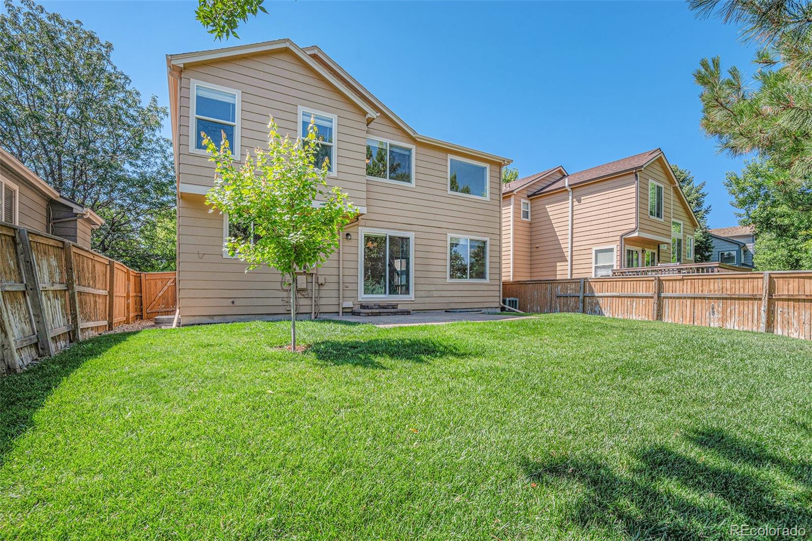 5253 Wangaratta Way Highlands Ranch, CO 80130 - Photo 28 of 43 a front view of a house with a yard