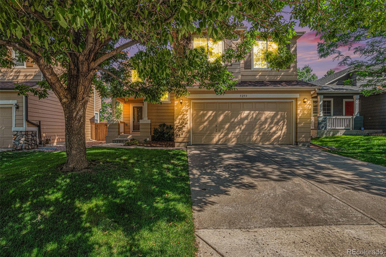 5253 Wangaratta Way Highlands Ranch, CO 80130 - Photo 31 of 43 a front view of house with yard and green space