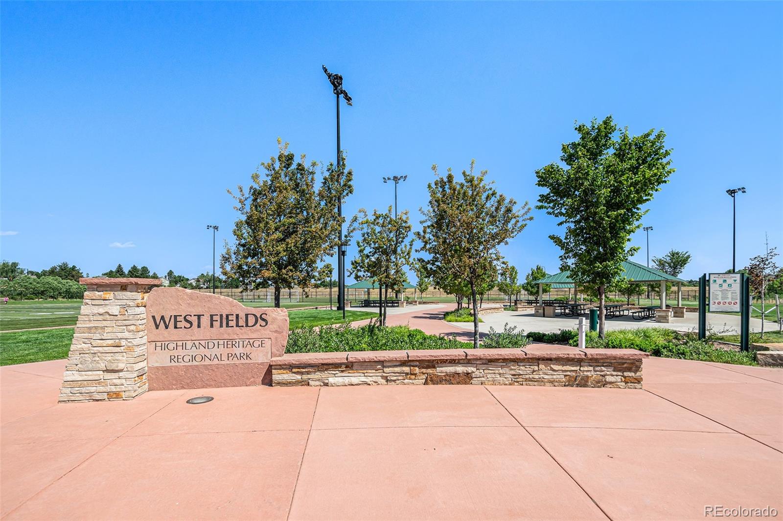 5253 Wangaratta Way Highlands Ranch, CO 80130 - Photo 38 of 43 a sign board on the side of a road