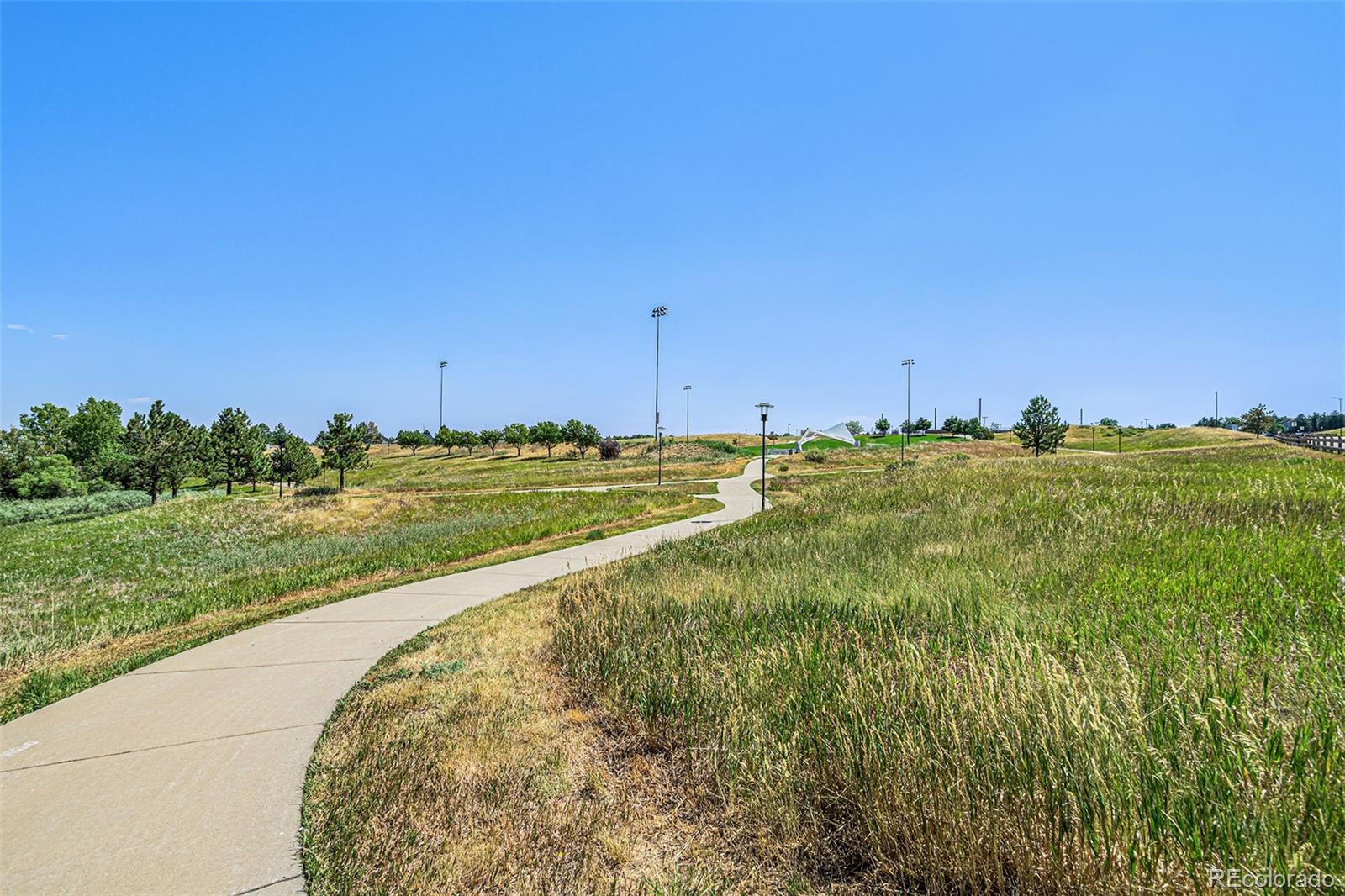 5253 Wangaratta Way Highlands Ranch, CO 80130 - Photo 42 of 43 a view of a large body of water with a building in the background