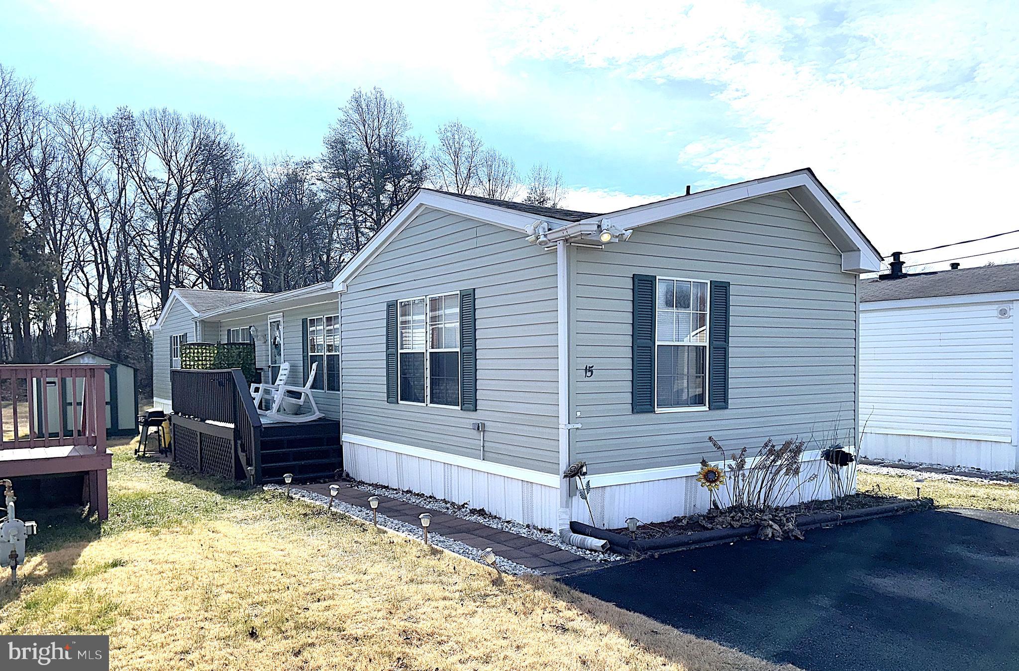7959 Telegraph Road, Unit 15 Severn, MD 21144 - Photo 1 of 26 a view of a house with a yard
