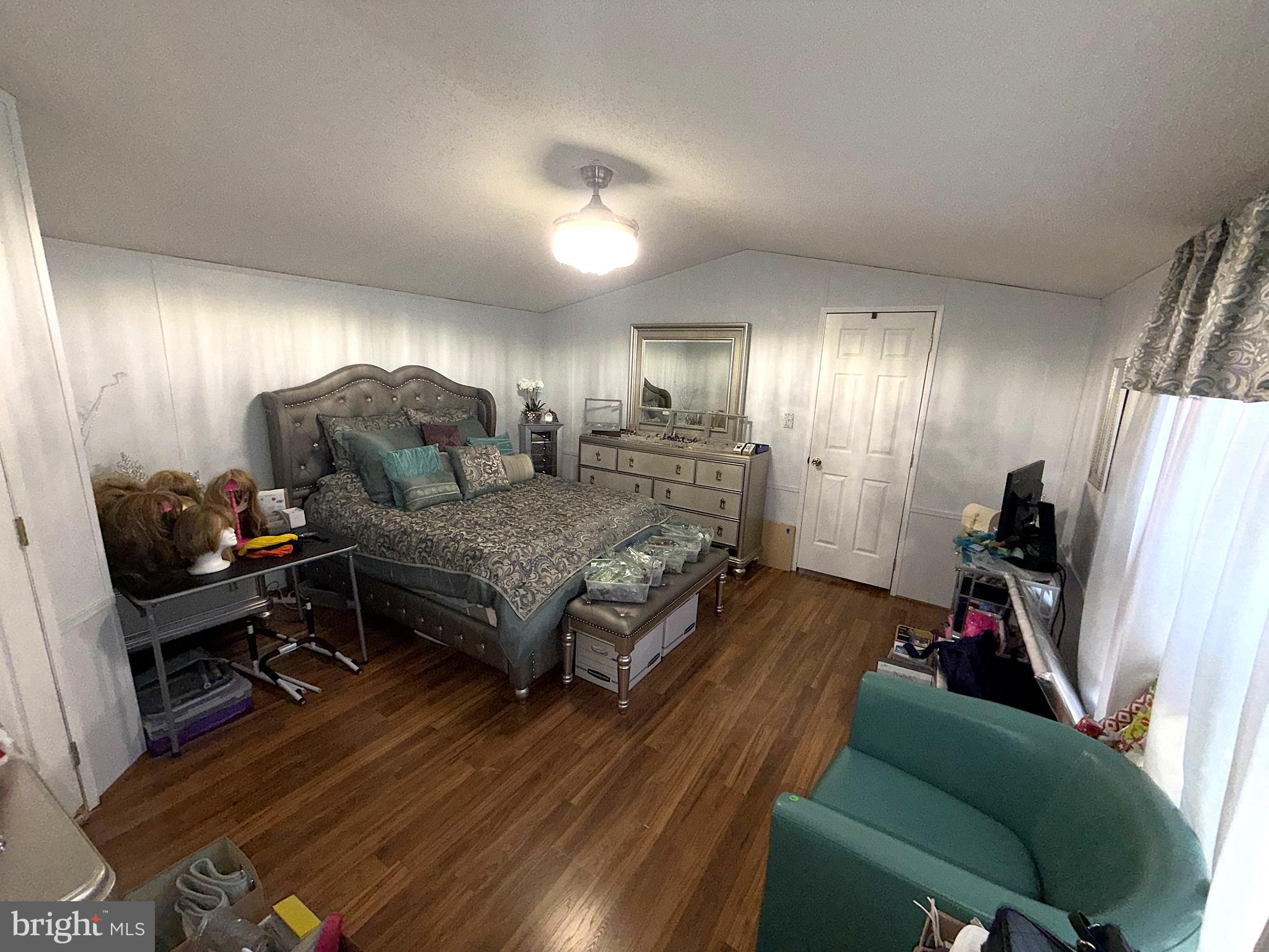 7959 Telegraph Road, Unit 15 Severn, MD 21144 - Photo 11 of 26 a living room with furniture and a flat screen tv