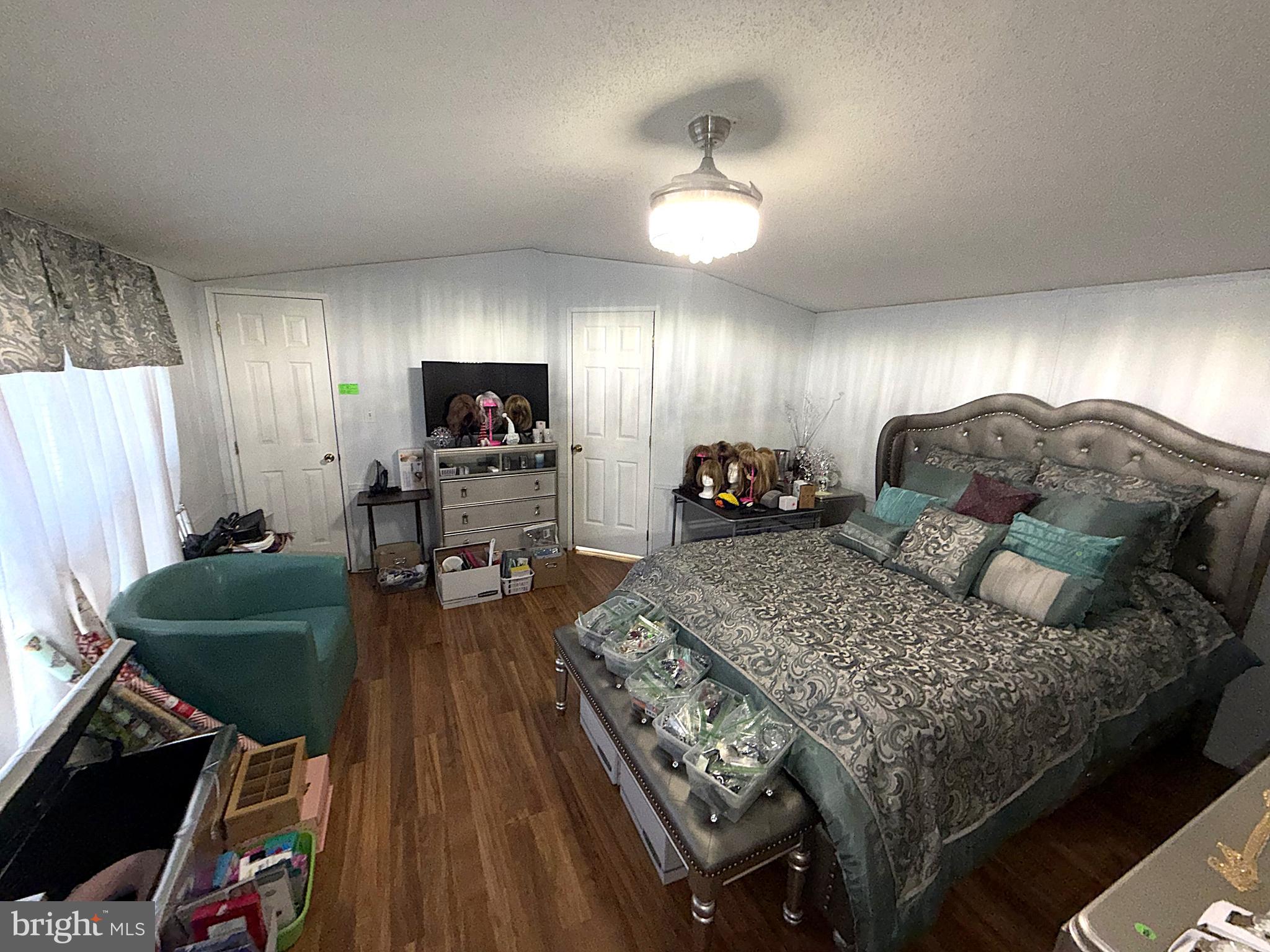 7959 Telegraph Road, Unit 15 Severn, MD 21144 - Photo 12 of 26 a living room with furniture and a wooden floor