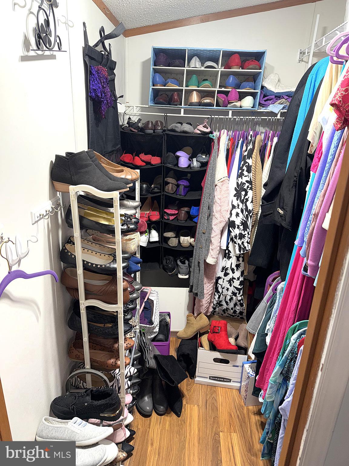 7959 Telegraph Road, Unit 15 Severn, MD 21144 - Photo 18 of 26 a view of walk in closet with clothes