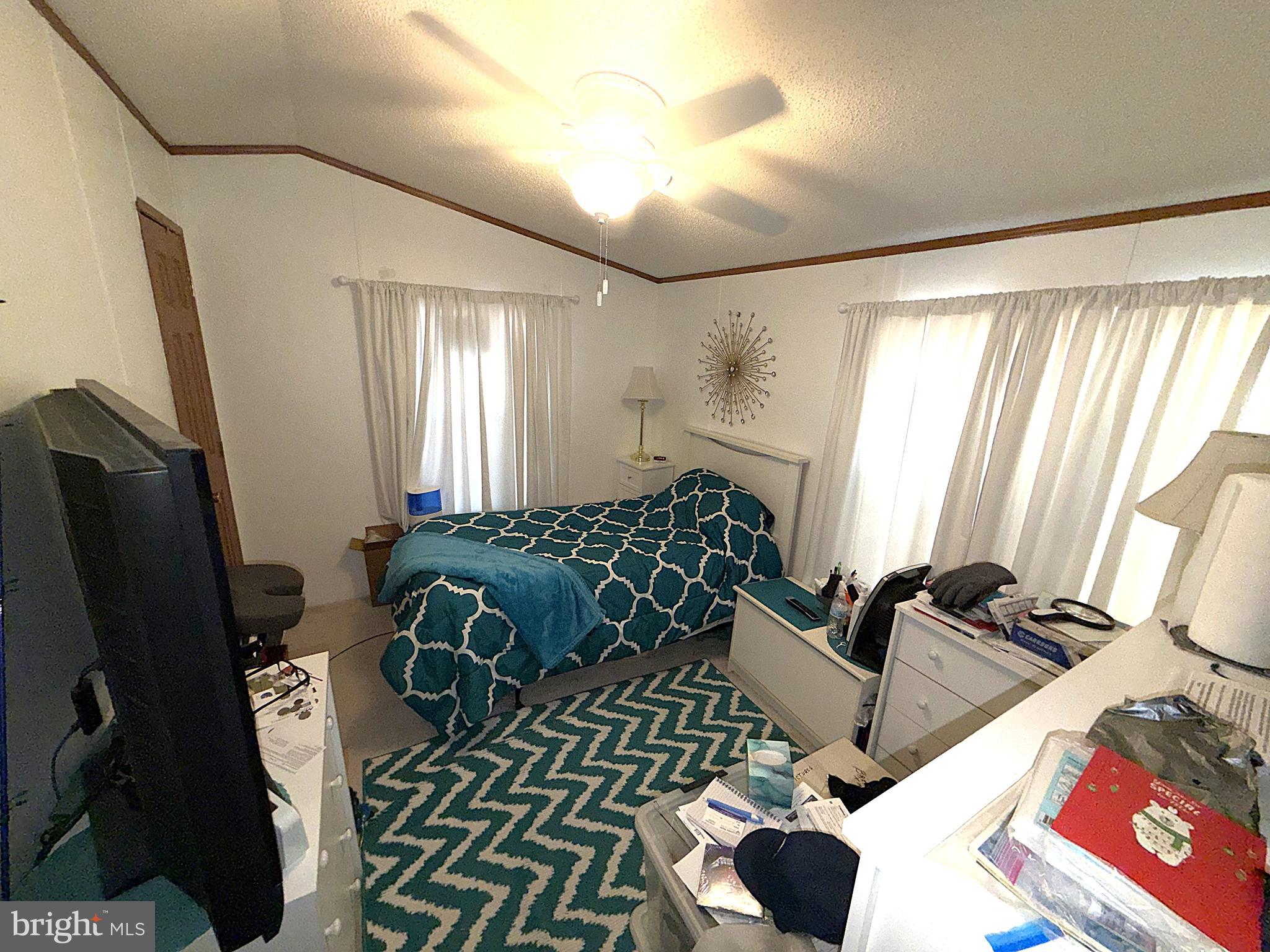 7959 Telegraph Road, Unit 15 Severn, MD 21144 - Photo 19 of 26 a bedroom with furniture and a window