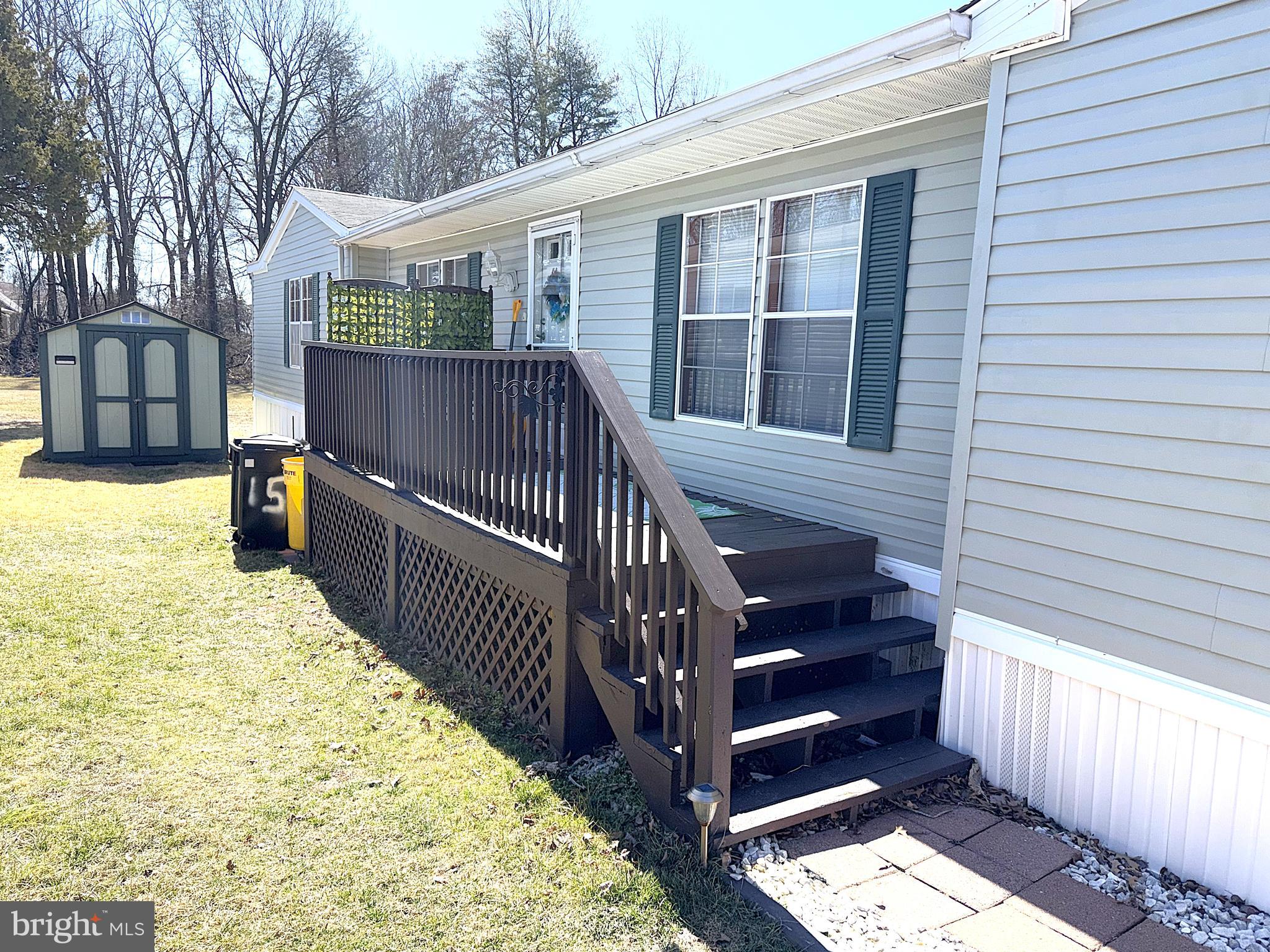 7959 Telegraph Road, Unit 15 Severn, MD 21144 - Photo 23 of 26 a view of a house with wooden fence