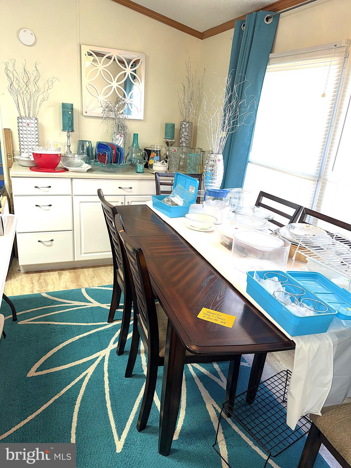 7959 Telegraph Road, Unit 15 Severn, MD 21144 - Photo 6 of 26 a dining room with furniture and a mirror