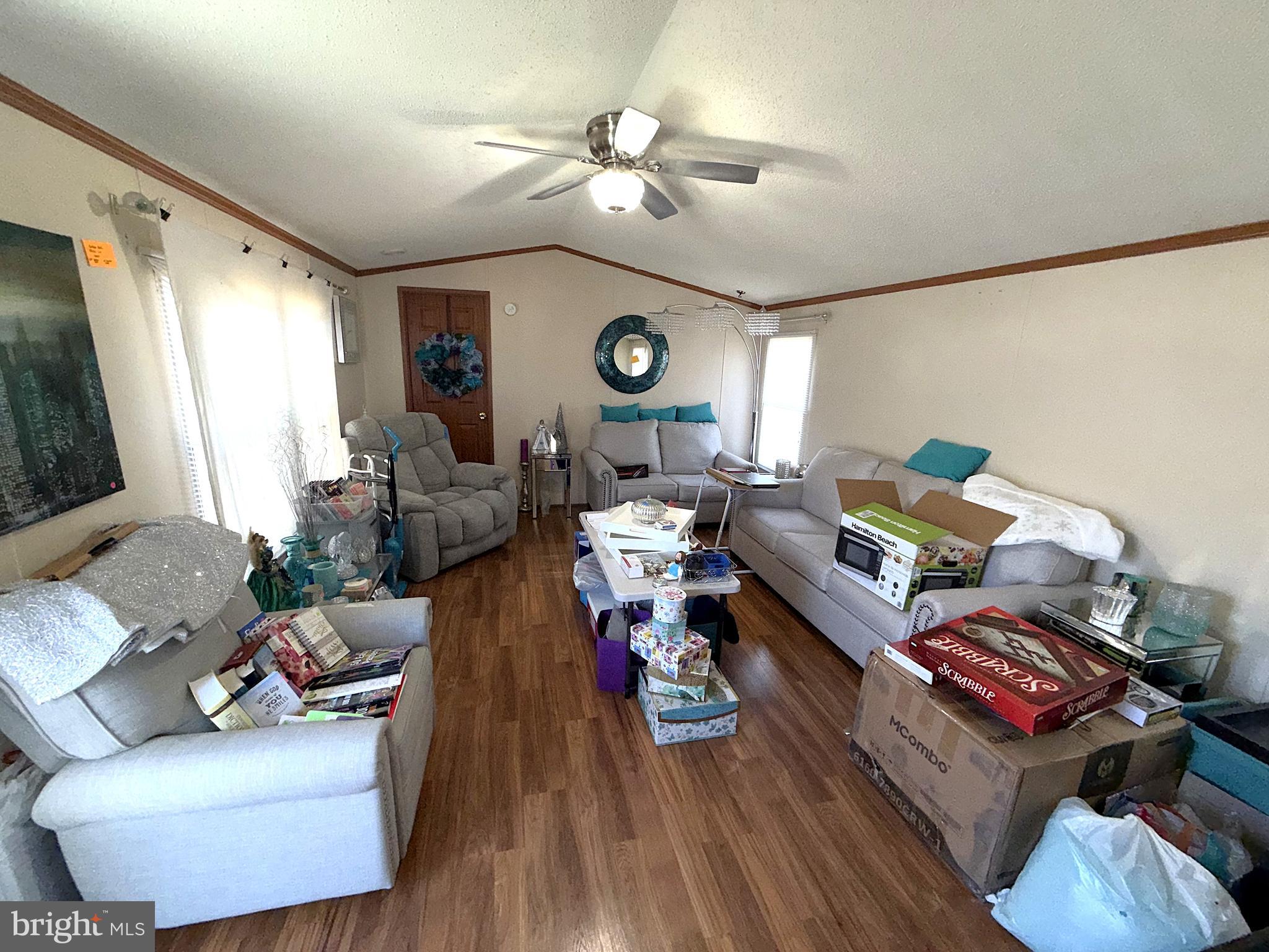 7959 Telegraph Road, Unit 15 Severn, MD 21144 - Photo 9 of 26 a living room with furniture and a wooden floor